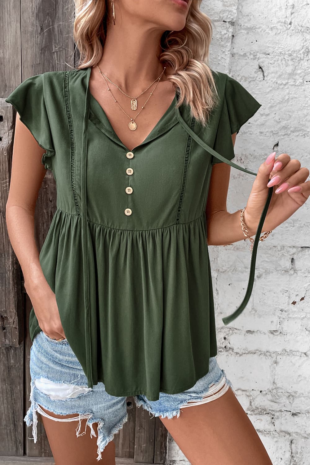 Perfee Buttoned Tie Neck Flutter Sleeve Babydoll Top – Trendsi | ClozArt