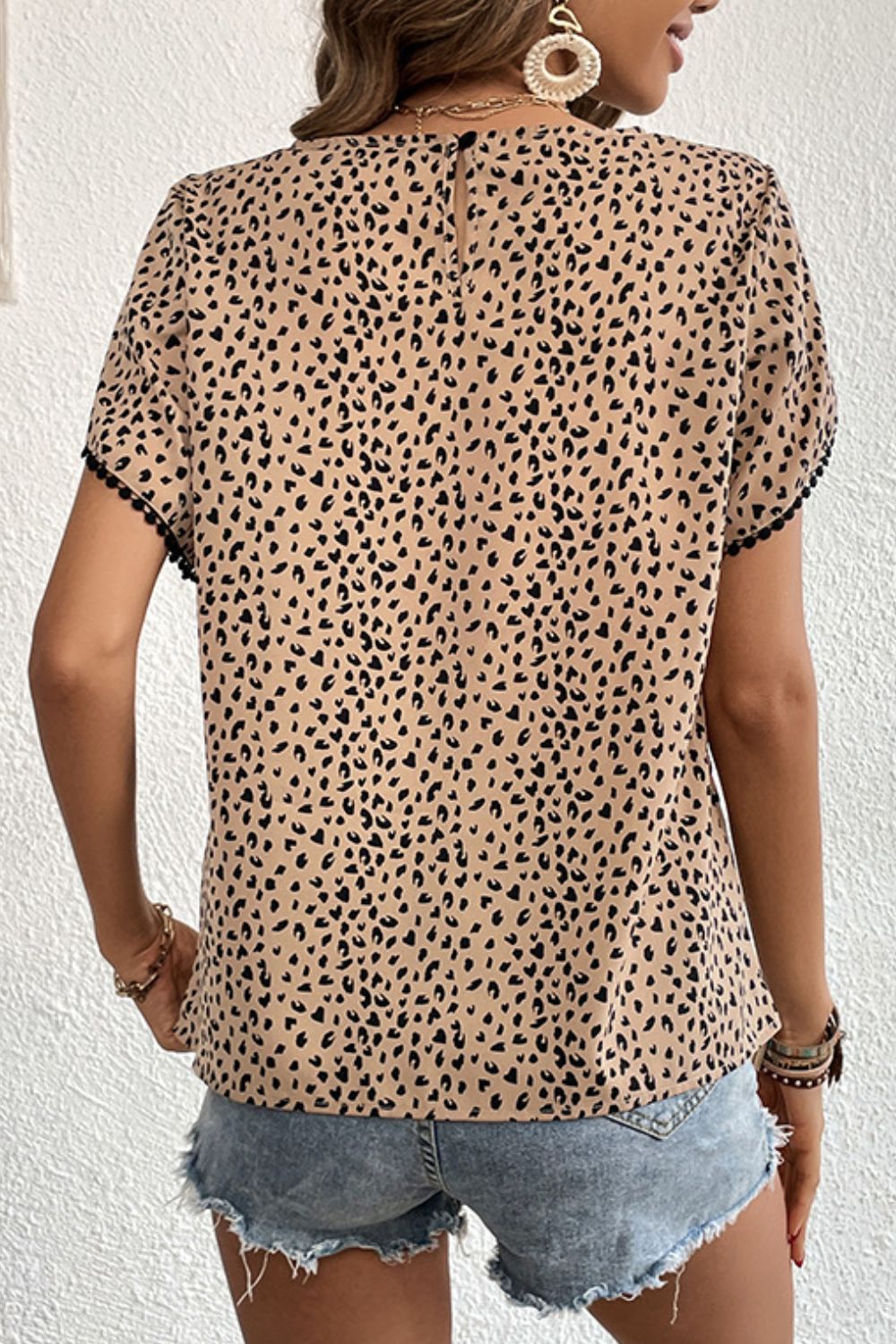 Perfee Printed Pom Pom Detail Petal Sleeve Round Neck Blouse – Trendsi | ClozArt
